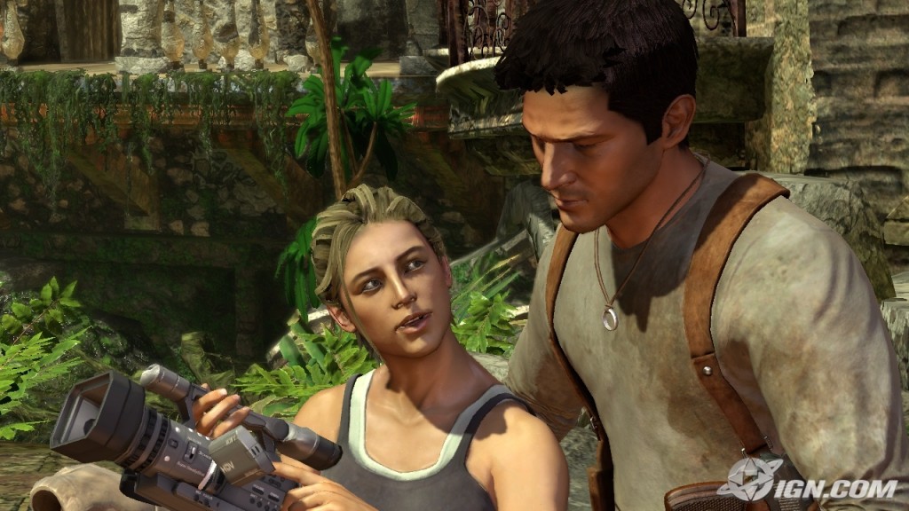 Drake and Elena, in a jungle ruin, looking at a camcorder